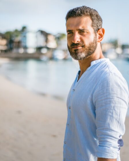 man standing on beach during daytime