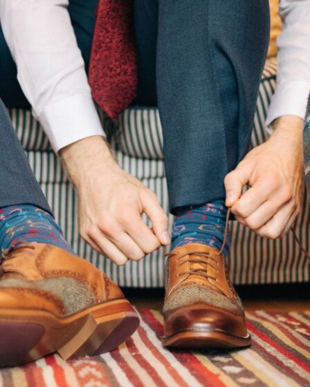 person holding shoe tie