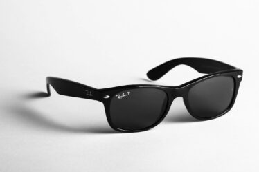 shallow focus photo of black Ray-Ban wayfarer sunglasses