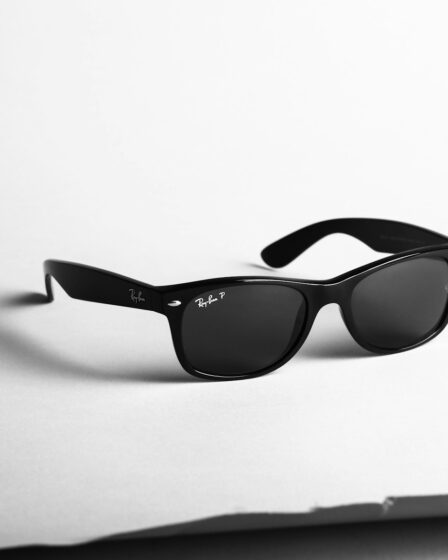 shallow focus photo of black Ray-Ban wayfarer sunglasses